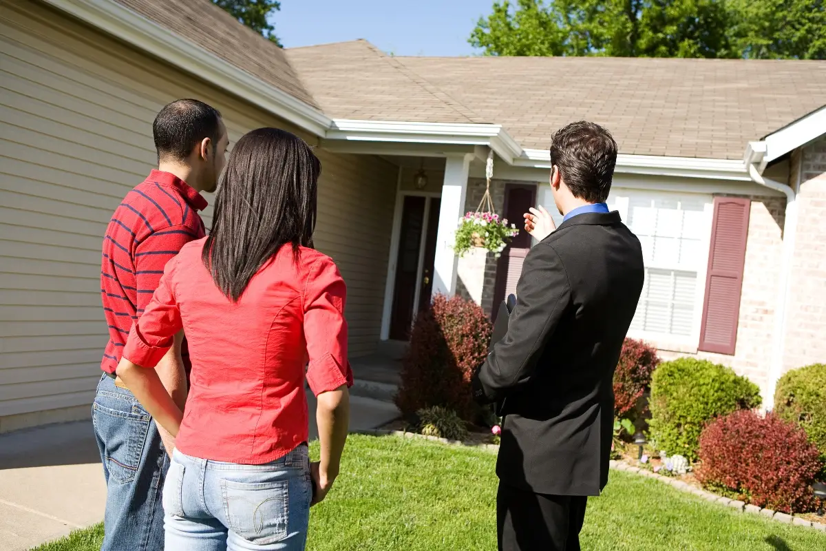 A real estate agent showing a house during a sellers market